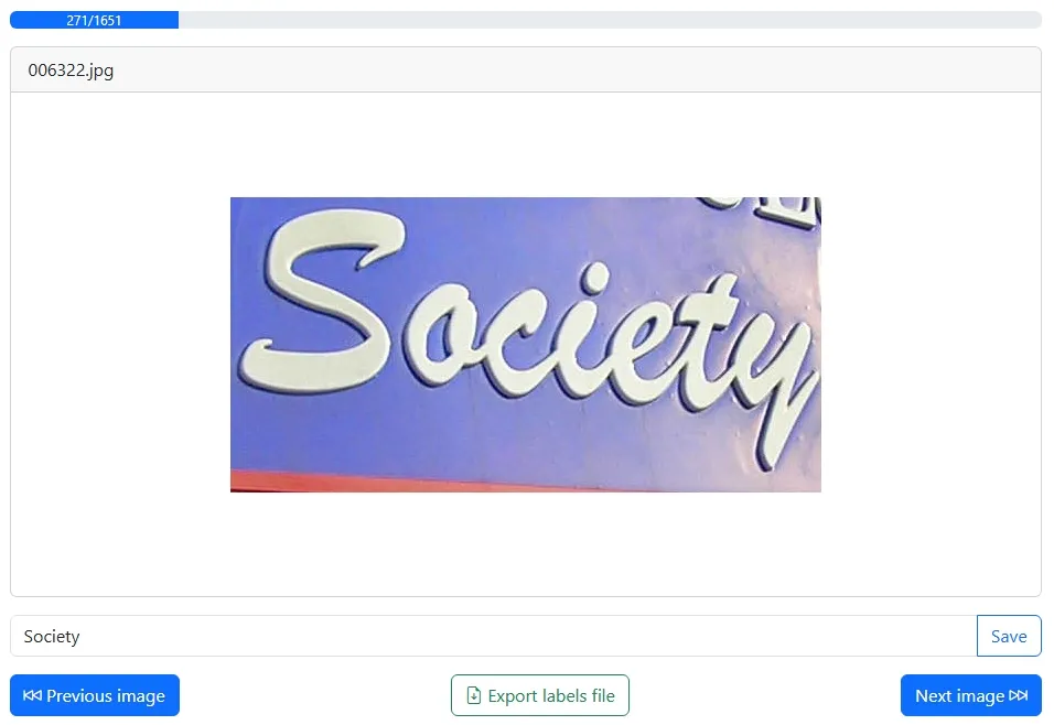 Screenshot of the app showing an example image that says 'Society' on it and it's corresponding label in a text input with three buttons below labeled 'Previous image', 'Export labels file' and 'Next image